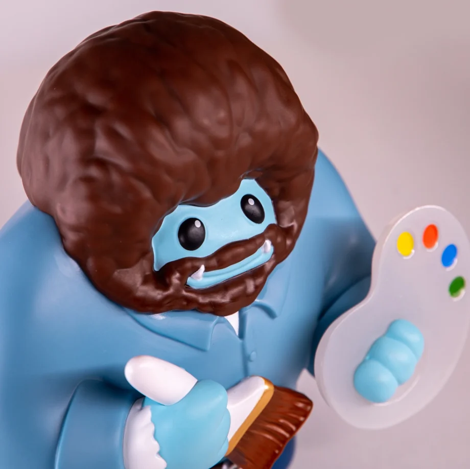 Bob Ross Chomp close-up showing the hair, beard, paintbrush and palette