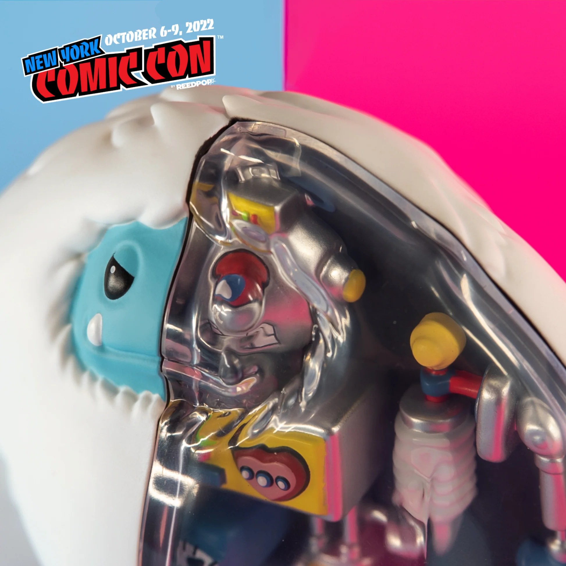 Robot Chomp close-up through the transparent cover, showing the robot face and chest